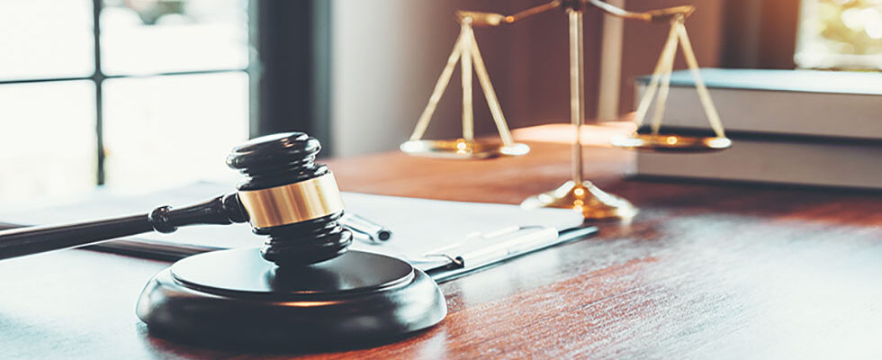 gavel and legal scales on a desk